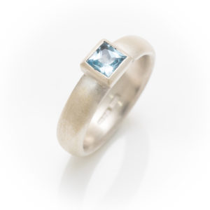 Silver ring with square topaz