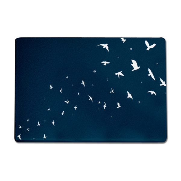 This extra large glass chopping board features a textured, hard-wearing and heatproof surface, along with anti-slip rubber feet.

Featuring my hand drawn Flock of Birds illustration in blue and white, this worktop saver adds a splash of colour to any kitchen. It can be used as a hard wearing chopping board, hygienic butchers block, colourful serving platter, cheese board or trivet heat mat and is made to the highest quality in the UK. I recommend wipe cleaning only to keep the mat in the best condition. 400mm x 285mm.