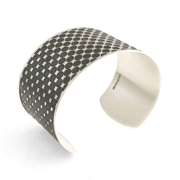 silver cuff with optical effect sideview on a white background