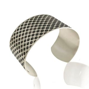 silver cuff with optical effect lateral view on a white background