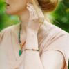 Model wearing a colourful gemstone bracelet