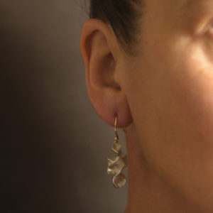 Drop silver earrings in a wave of silver by Cornwall designer Emily Nixon