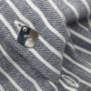 Hand-carved Personilised Minimalist Silver CZ Apparel Button is shown on the striped shirt.