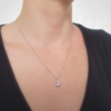 Handmade Custom Cubic Zirconia Solitaire Pendant Necklace is worn on the woman worn on a white lady.