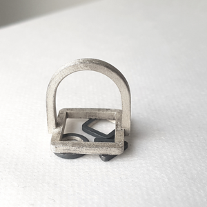 Artisan Geometric Patina Statement Ring in Sterling Silver is displayed on the white surface.