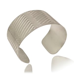 Wide Silver Oval Cuff With Etched Lines on a White Background Sideview