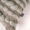 Texture detail of the handwoven square 'Burrows' cushion featuring Merino wool by Cassandra Sabo