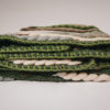 Blanket stitch detail of the Handwoven 'Caterpillar' throw featuring Merino wool by Cassandra Sabo