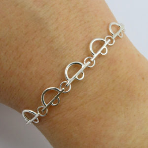 Arc Lace Cuff Bracelet Being worn an art deco style bracelet made in Sterling Eco-Silver