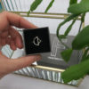 Arc bow ring in box sterling ec-silver with faceted gift box in background