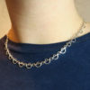 Arc Lace Sterling Eco-Silver Necklace on model wearing blue dress