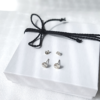 Handmade sterling Silver studs with silver nut on the white gift box tied with black cotton string.