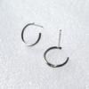 Minimalist Circle Sterling Silver Stud Earrings on a white background