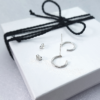 Circle Wire Silver Earrings on the white gift box tied with black cotton string.