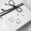 Square Wire Silver Earrings on the white gift box tied with black cotton string.