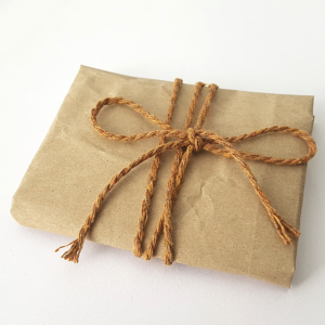 Brown wrapping paper tied with brown cotton string.