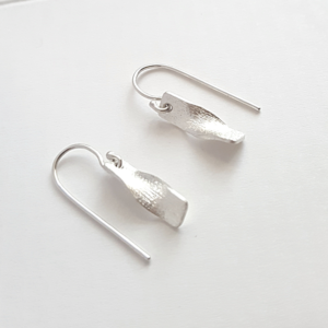 Handmade Sterling Silver Dangle Earrings on a white surface.