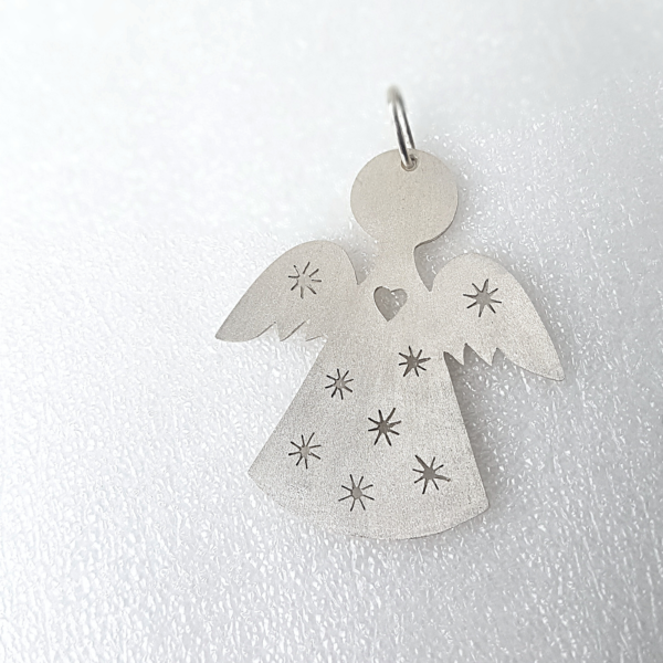 Handmade Sterling Silver Angel-Shaped Hanging Keepsake on a white surface.