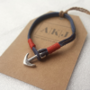 Men's Anchor Leather Bracelet on a brown AKJ labeled card.
