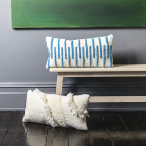 Hand tufted cushion in aCream and pale Blue m stripe.