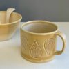 Ceramic stoneware stamp impressed mug with matt glazes