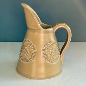 Small yellow jug with flower pattern