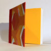 square book in red and yellow with yellow endpapers